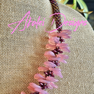 Pop-Up Mākeke - Akalei Designs - Pink Transparent Rose Petal Haku Lei Necklace - Close Up