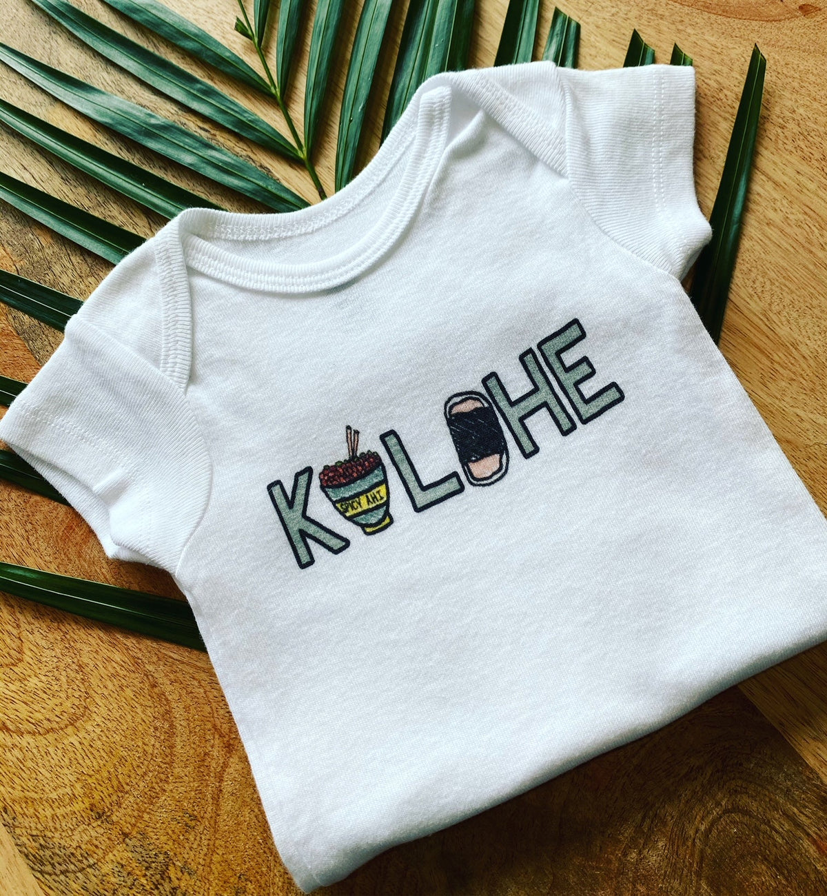 Pop-Up Mākeke - Sal Terrae - Kolohe Baby Onesie