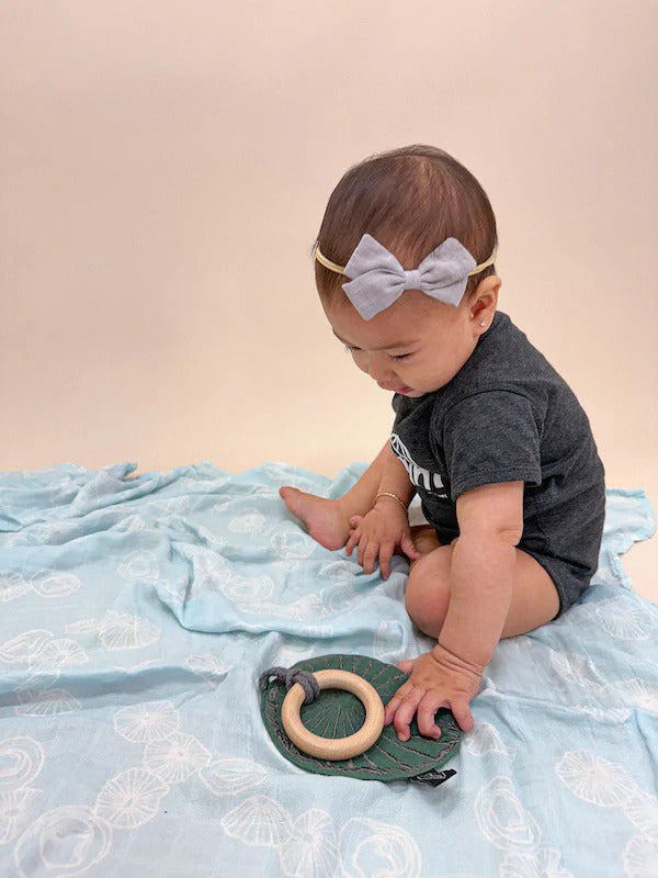Pop-Up Mākeke - The Keiki Department - Bamboo Muslin Baby Swaddle Blanket - Blue Opihi Shells - Front View